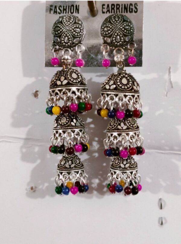 Ladies' earrings in Bangladesh come in a wide variety of styles and designs. From traditional to modern, you can find earrings made from materials such as gold, silver, brass, and various gemstones. Common styles include studs, hoops, dangly earrings, and jhumkas, each reflecting the rich cultural influences of Bangladesh. Designs often incorporate intricate patterns, filigree work, and colorful gemstones, making them suitable for various occasions and personal preferences.